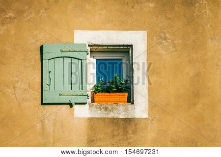 Isolated shabby chic window on stucco wall