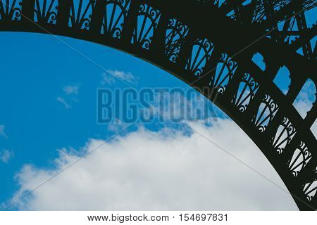 Silhouette of Eiffel tower arch with cloud in background