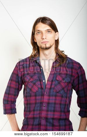 Masculinity concept. Man in plaid shirt. Young male posing on white background.