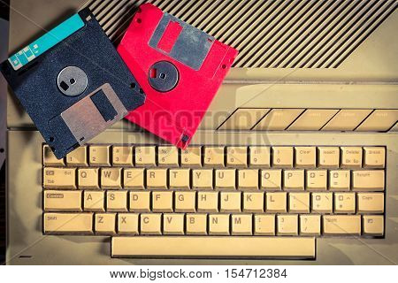 Closeup of vintage floppy disks and keyboard