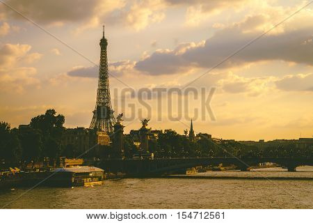 Eiffel tower beside river Seine in the evening