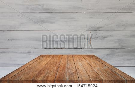 Perspective brown table top with white wooden wall background, stock photo
