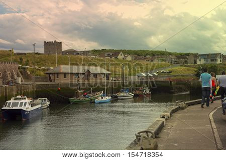 Boats and houses in Eyemouth old fishing town in Scotland UK. 07.08.2015