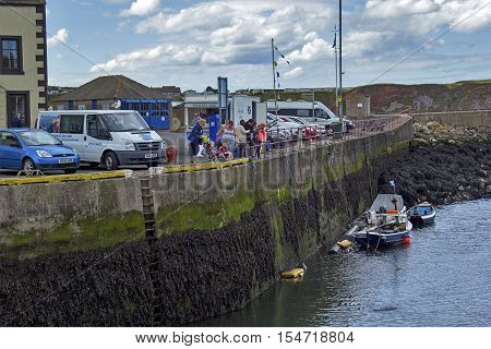 Boats and houses in Eyemouth old fishing town in Scotland UK. 07.08.2015