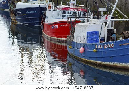 Boats and houses in Eyemouth old fishing town in Scotland UK. 07.08.2015