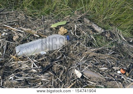 Empty plastic bottle abandoned on the beach on Mando island in Denmark. Danish national park under UNESCO World Heritage.