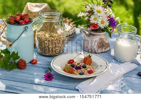 Summer breakfast in the garden on old table