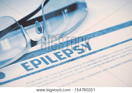 Diagnosis - Epilepsy. Medical Concept on Blue Background with Blurred Text and Pair of Spectacles. Selective Focus. 3D Rendering.