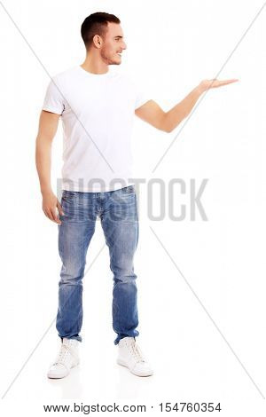 Young man showing something on palm