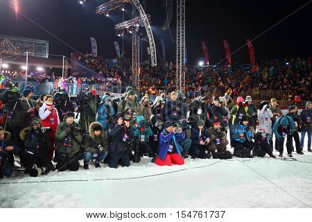 MOSCOW, RUSSIA - FEB 13, 2016: Photographers work during World Cup FIS Freestyle at dark night in Krylatskoye