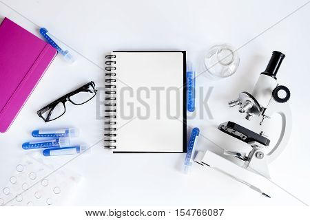 medical student working place with blank open notebook space for text top view