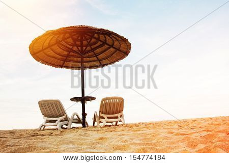 Sea Coast Resort With Two Chaise-longues
