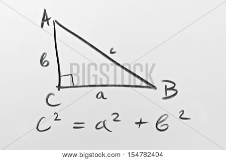 Sketch of a right triangle and the famous Pythagorean formula