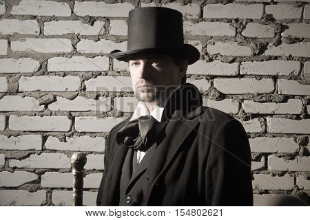 Victorian Man In The Black Coat, Top Hat And In A Tie