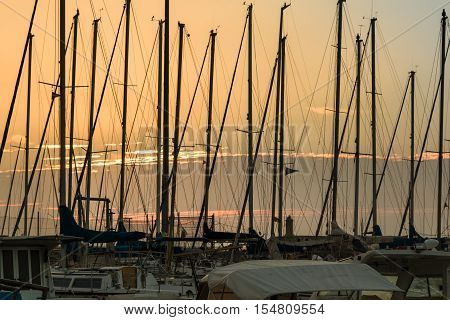 Sailing Boat's Masts: Dock Seaside at Sunset