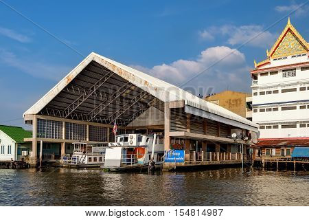 Bangkok, Thailand - December 8, 2015: Parking for boats under a canopy near Wat Soi Thong. It is on the bank of the river in northern Bangkok along the regular route of the Chao Phraya river boats.