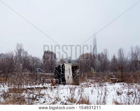 Temporary self-made shelter covered with the snow in winter.