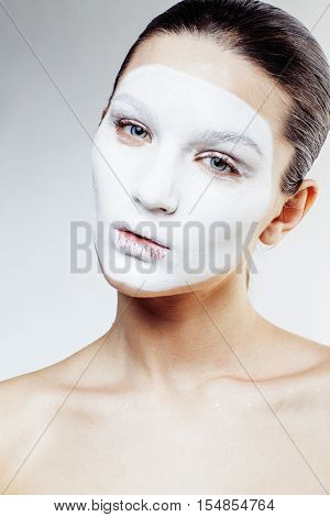 young pretty woman with facial white mask isolated close up spa, lifestyle real people healthcare concept