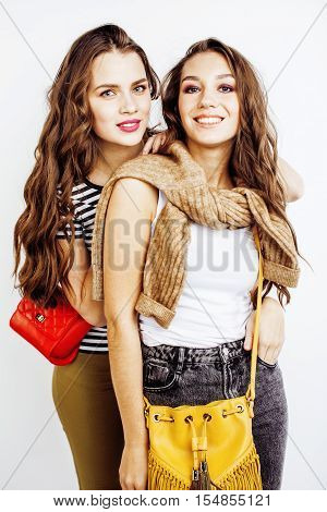 two best friends teenage girls together having fun, posing emotional on white background, besties happy smiling, lifestyle people concept close up