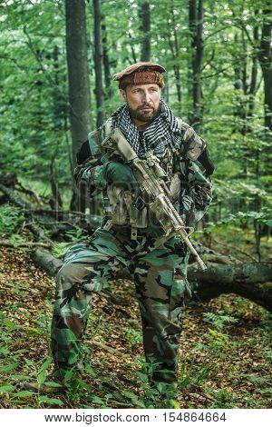 Member of Navy SEAL Team also known as Taliban hunter with weapons
