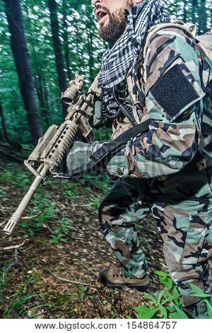 Member of Navy SEAL Team also known as Taliban hunter with weapons