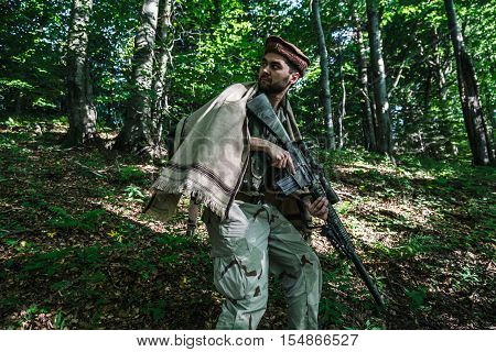Member of Navy SEAL Team also known as Taliban hunter with weapons