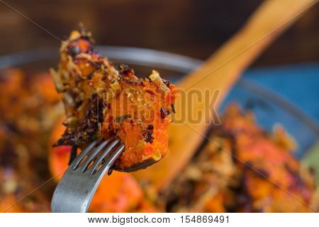 Tasting Vegetarian Baked Pumkin, Mixed Vegetables, Herbs, Cheese With Folk