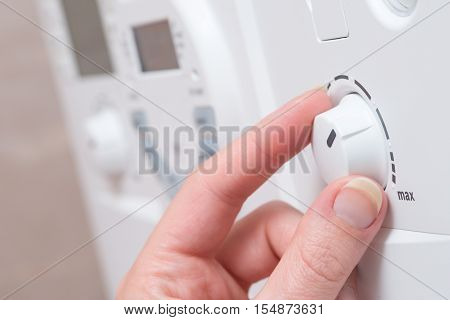 Hand Turning Dial On Boiler Unit Or Appliance