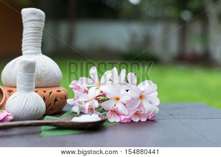Spa massage compress balls herbal ball on the wooden with treaments spa Thailand select focus