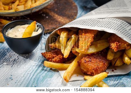 Closeup Of Fish & Chips Served In The Newspaper