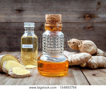 Alternative Medicine And Nature Spas Ingredients - Ginger Root And Ginger Essential Oil Set Up On Ol