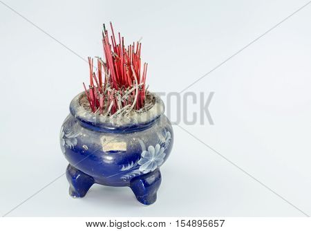 Incense burner and fire on white background