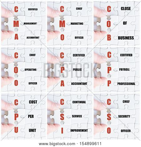 Hand Of Business Man Completing The Puzzle