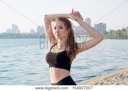 Sporty Woman Rests During Fitness Workout Exercises Outdoor In Morning
