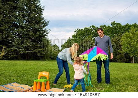 Mother dad and child in the park.
