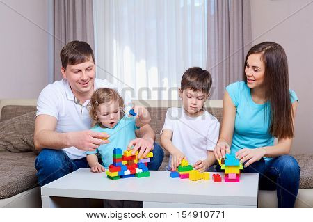 Family playing game together at home. Happy family.