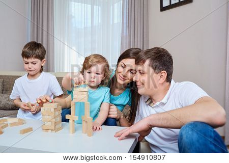 Happy family playing together at home. Happy family.