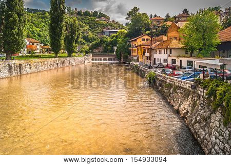 View at landscape in old town Sarajevo with river Miljacka in foreground, Bosnia and Herzegovina, Europe.