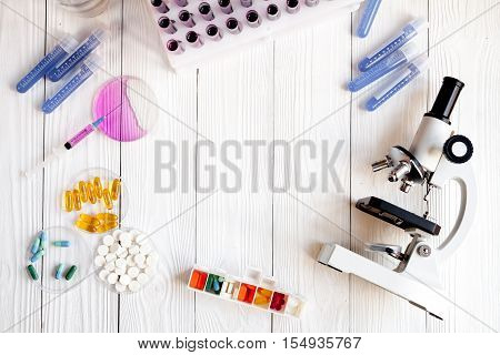 workplace lab assistant with microscope at the clinic top view no one
