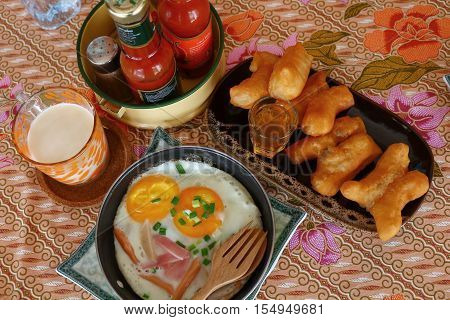 Another kind of Thai style breakfast with eggs and Patongko