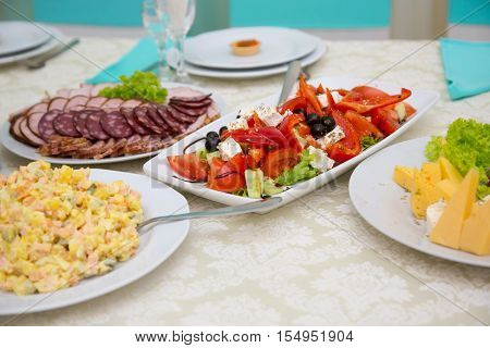 Salad of tomatoes peppers and cheese. Bufet Table