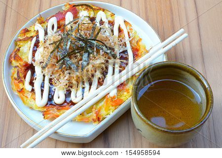 Japanese food okonomiyaki , Japanese pizza. Traditional food in Hiroshima, Japan