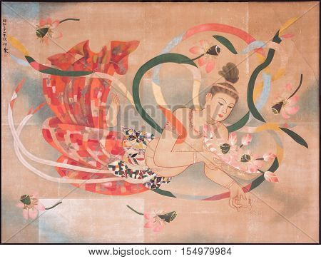 Tokyo Japan - September 26 2016: Sensual peach and red colored image of a floating half-naked woman painted on the ceiling of the main Honzo hall at Senso-ji Buddhist Temple.