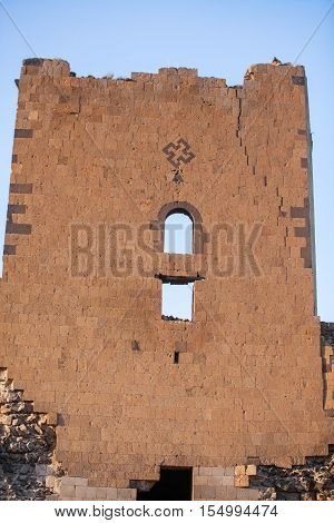 Swastika mark on a wall in Ani Turkey. Ani used to be the capital of the Bagratid Armenian kingdom between 961 and 1045.