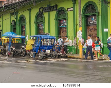 Rickshaws On A  Street