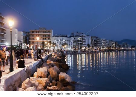 Loutraki, Greece - July 1, 2018: Loutraki Embankment Lights Up Late At Night. Corinthian Gulf Of The