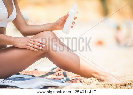 Closeup On Woman Hand Applying Sunscreen Creme On Leg. Skincare. Sun Protection Sun Cream, On Her Sm
