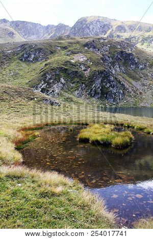 Glacial Lake - Sky And Mountains Reflected In The Water