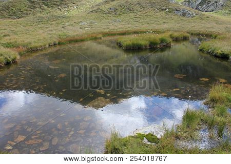 Glacial Lake - Sky And Mountains Reflected In The Water