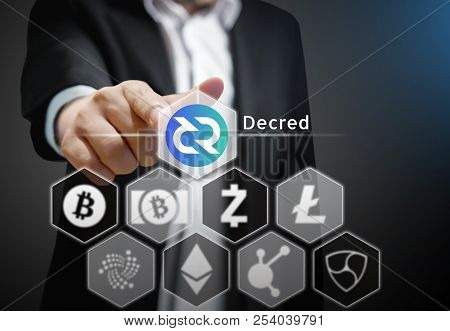Business Man Points His Finger At  Decred Coin  Icon  Among Others Crypto Currency On Virtual Touch 